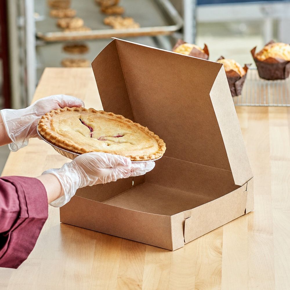 A freshly baked pie boxed for takeaway